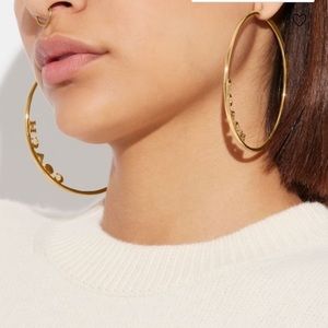 Brass gold tone hoop Coach earrings